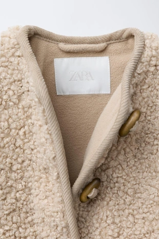 Куртка из искусственной овчины с застежкой на пуговицы- Заказать в России