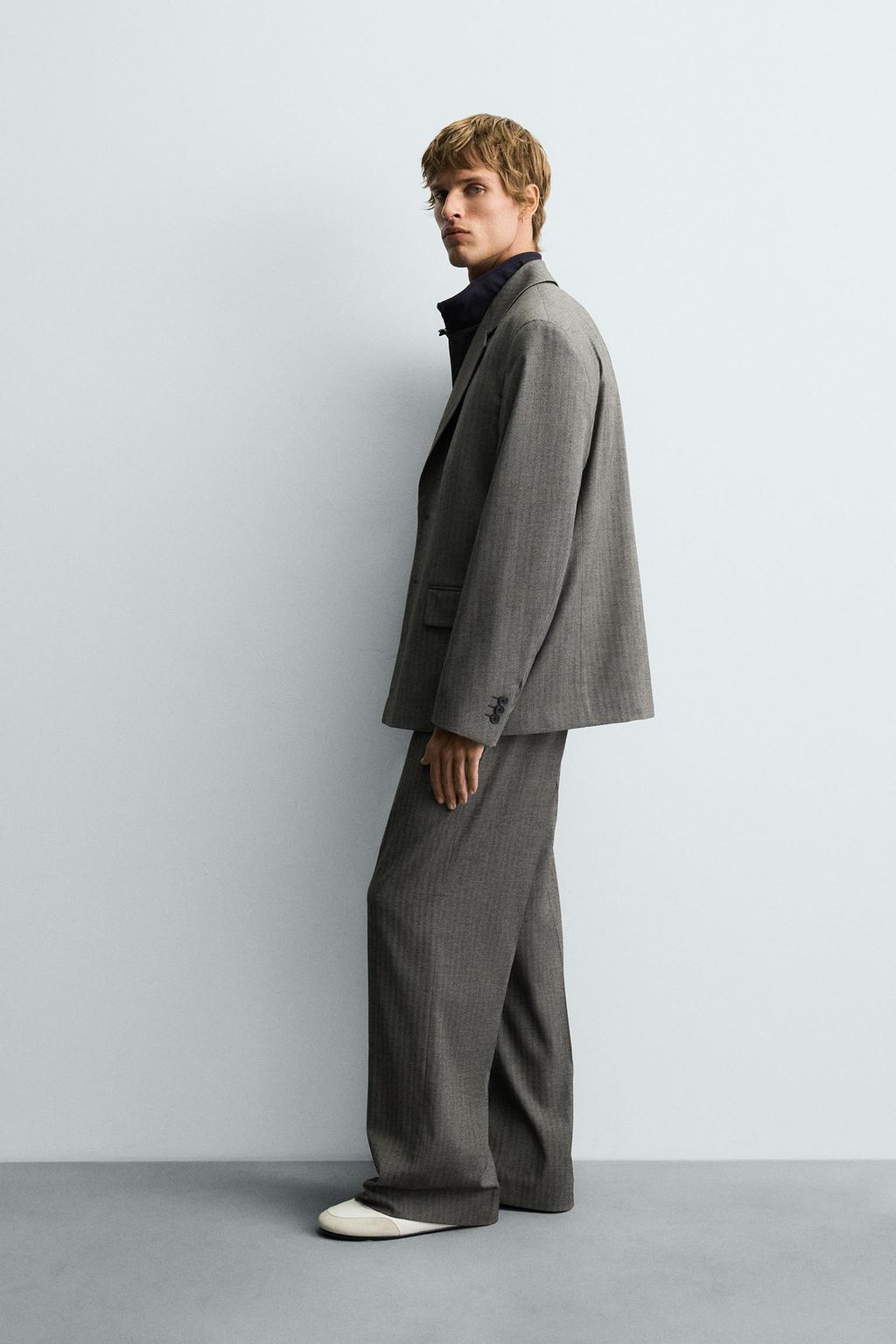 БРЮКИ FLARE FIT КОСТЮМНЫЕ В ЕЛОЧКУ