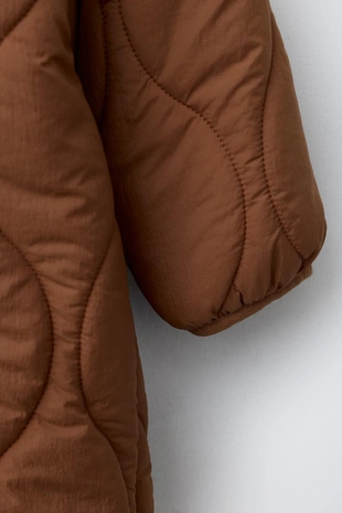 Длинный стеганый комбинезон- Заказать в России