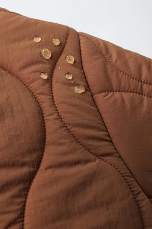 Длинный стеганый комбинезон- Заказать в России