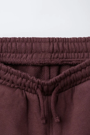 Брюки-джоггеры из мягкой ткани с этикеткой- Заказать в России