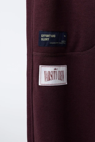 Брюки-джоггеры с нашивками- Заказать в России