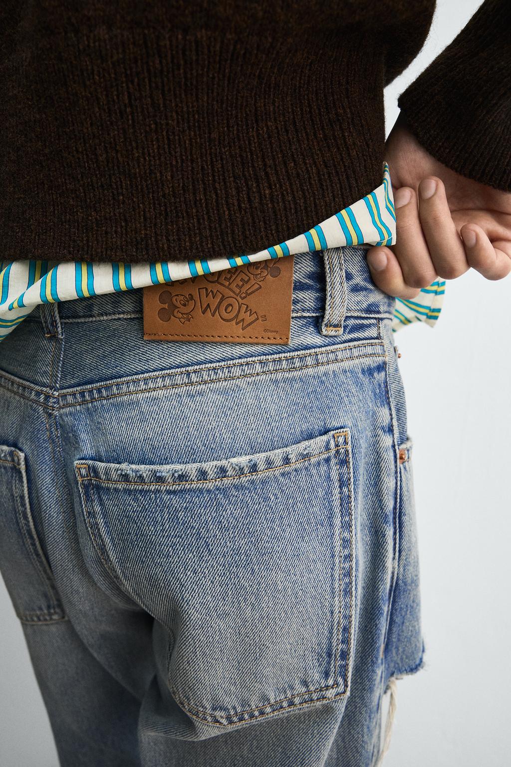 РАСКЛЕШЕННЫЕ ДЖИНСЫ С РАЗРЕЗАМИ HARRY LAMBERT FOR ZARA X DISNEY