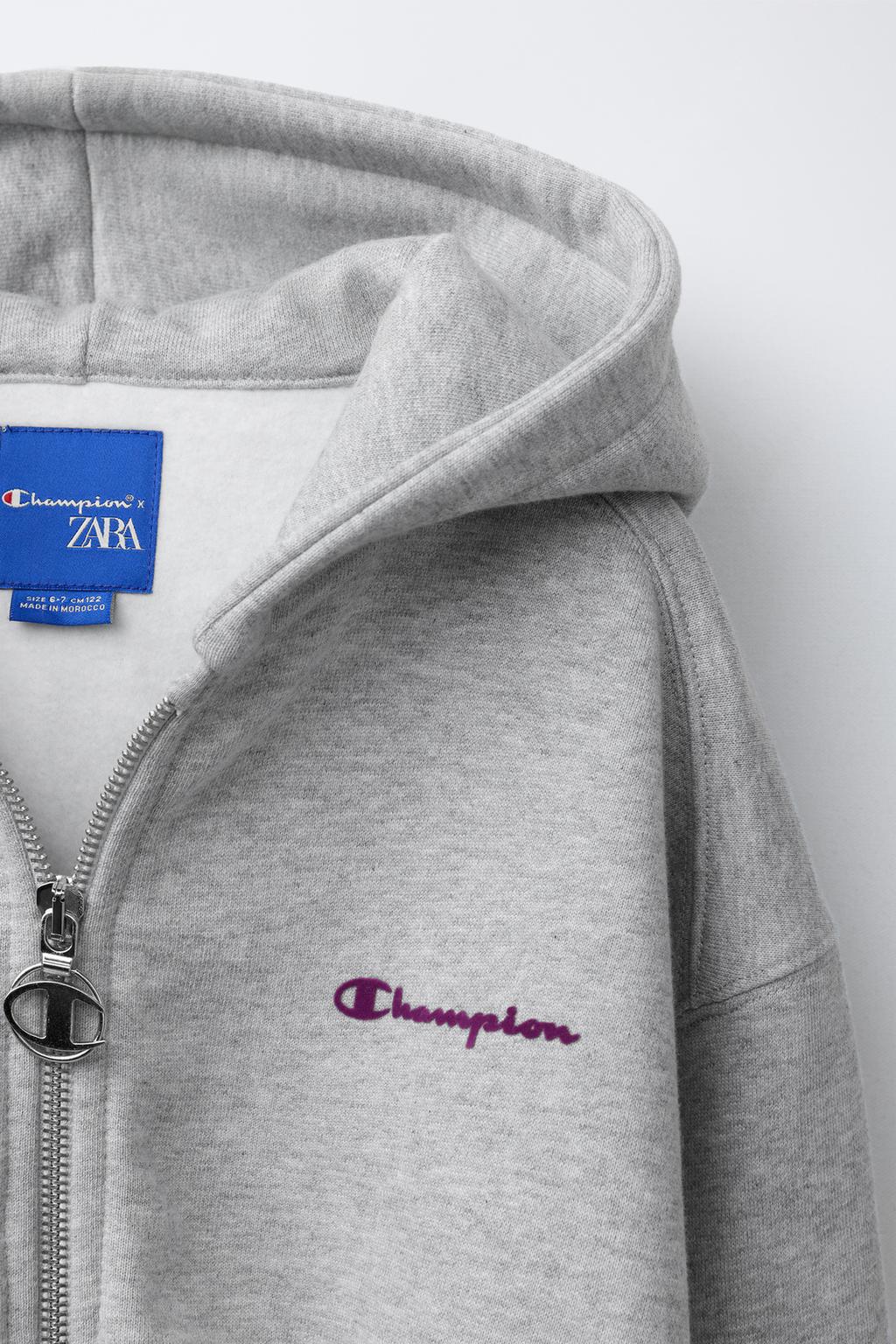 ТОЛСТОВКА НА МОЛНИИ С ТЕКСТОМ И ФЛОКОМ CHAMPION ® X ZARA
