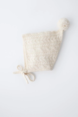 Чепчик вязки «косы» с помпоном- Заказать в России