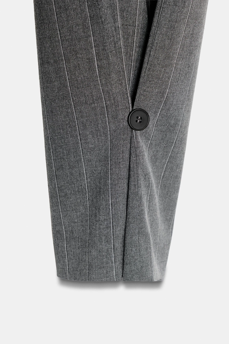 Брюки с запонами и пуговицами на низу