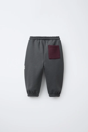 Брюки-джоггеры в стиле колор-блок с нашивкой- Заказать в России