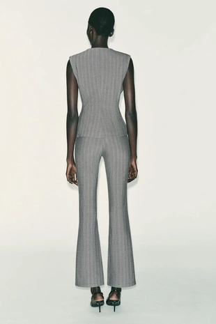 Жилет «ёлочка» расклешённого кроя- Заказать в России