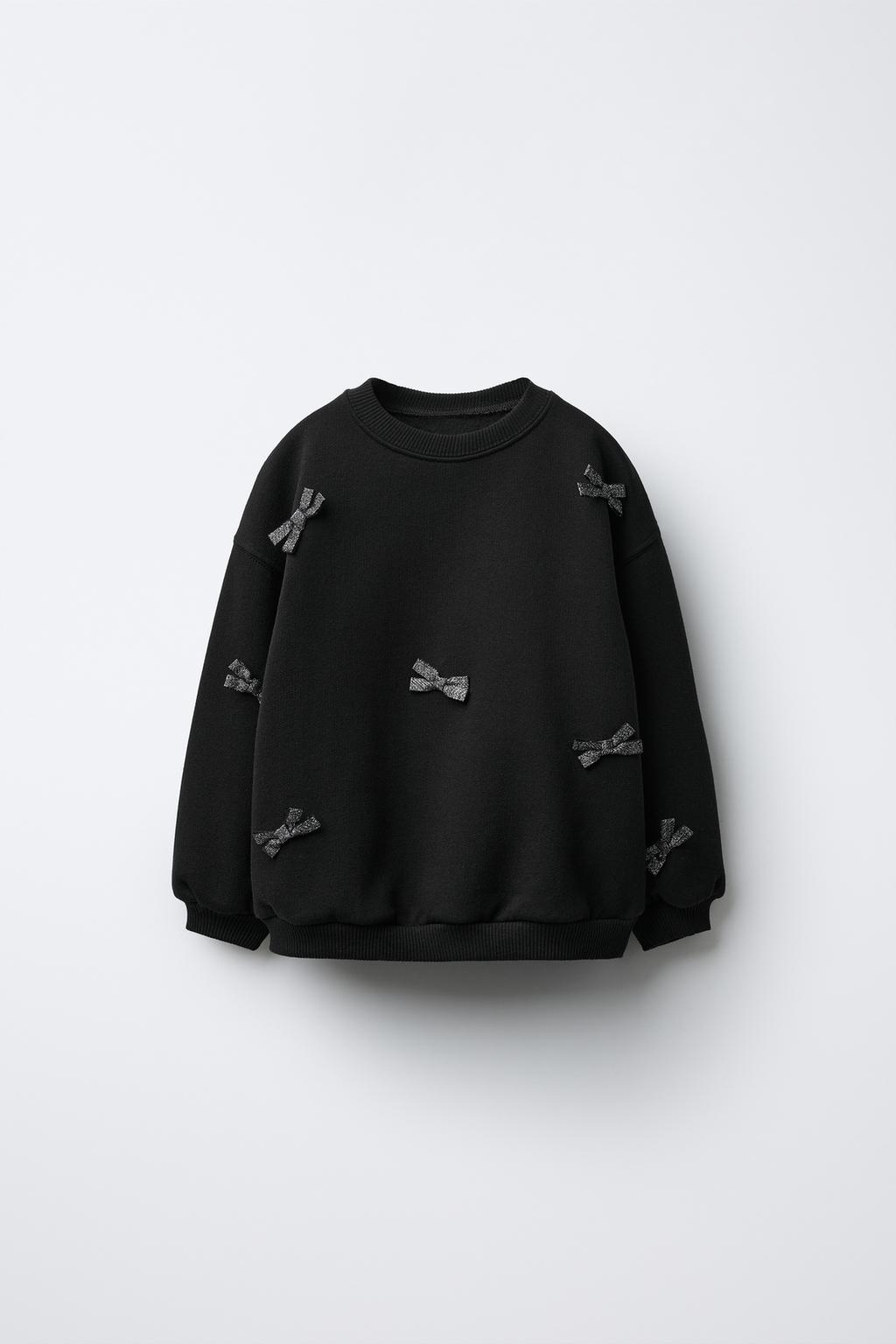 ТОЛСТОВКА С БАНТАМИ И БЛЕСТКАМИ