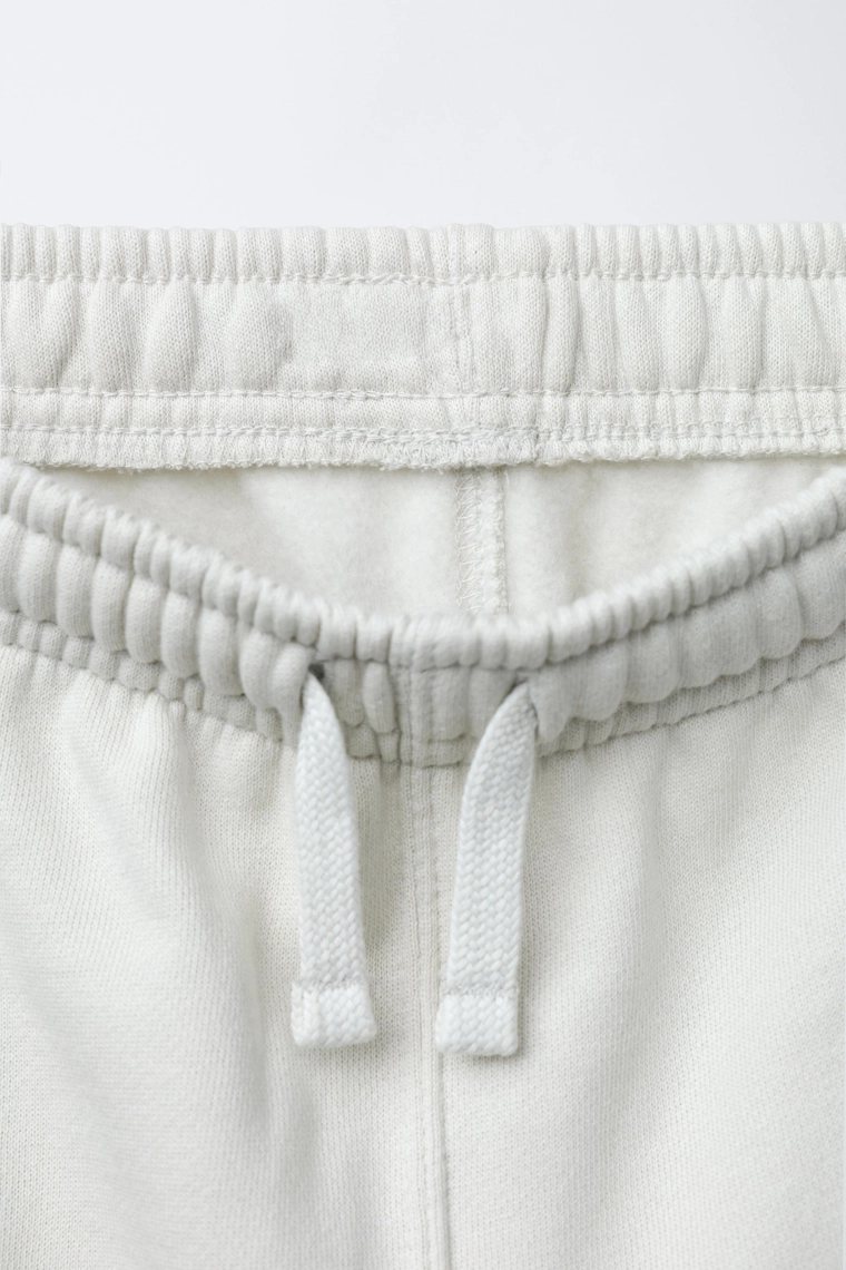 Джоггеры со значком zara