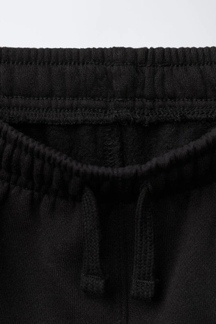 Брюки-джоггеры с этикеткой- Заказать в России