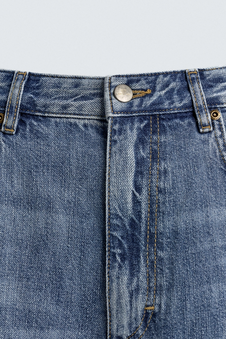 Джинсы свободного кроя с кляксами краски