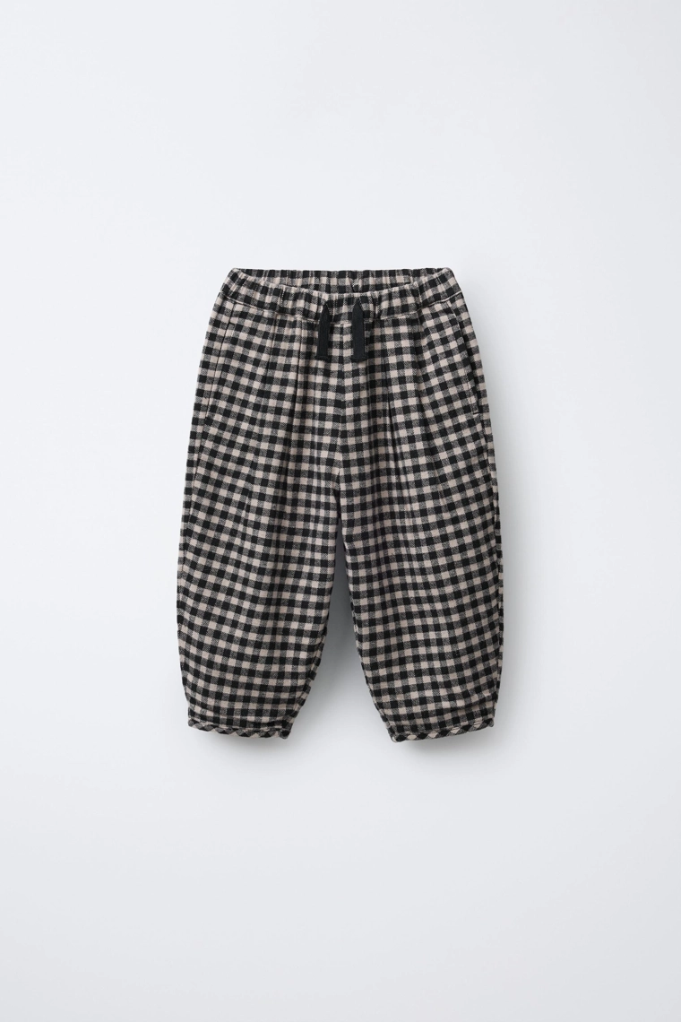 Брюки в клетку с объемным кроем