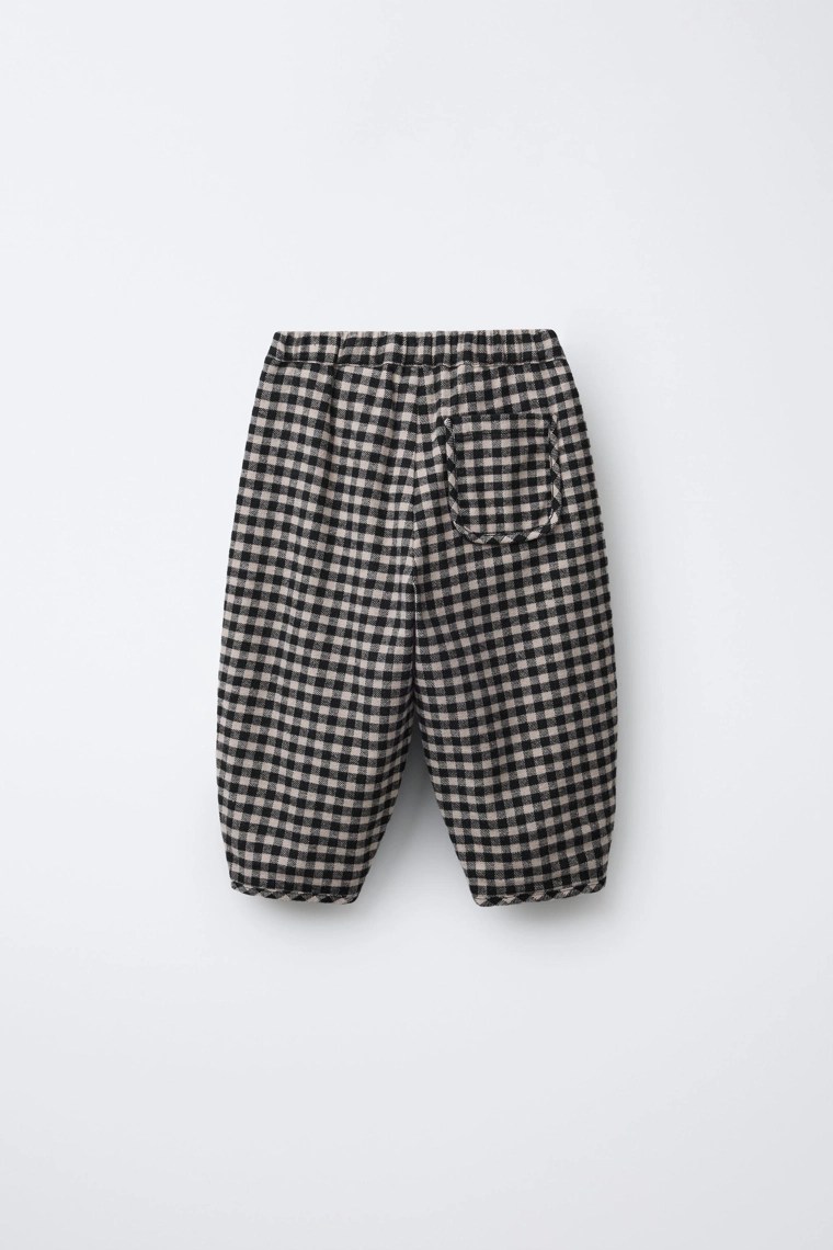 Брюки в клетку с объемным кроем
