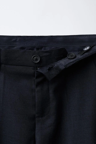 Костюмные брюки из рельефной ткани- Заказать в России