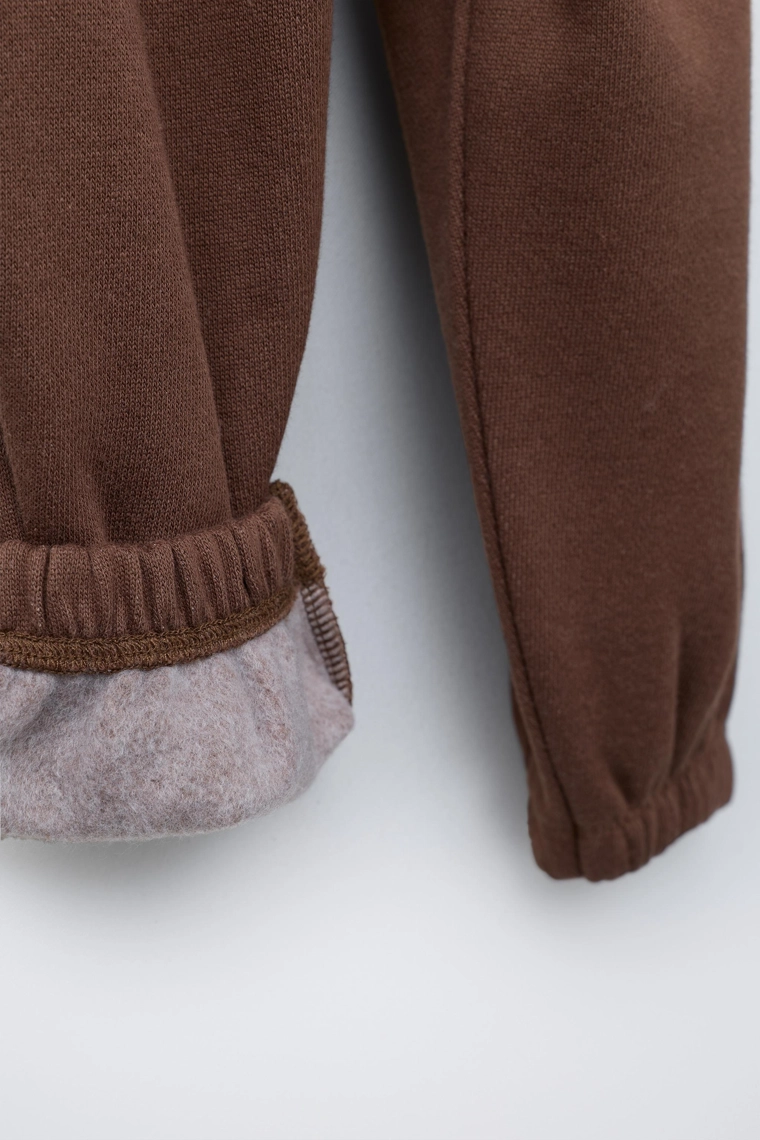 Брюки со стразным текстильным принтом