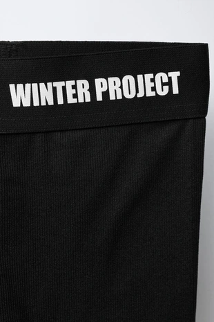 Термолегинсы в рубчик с рельефным текстом- Заказать в России