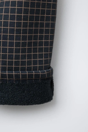 Брюки свободного кроя в клетку- Заказать в России