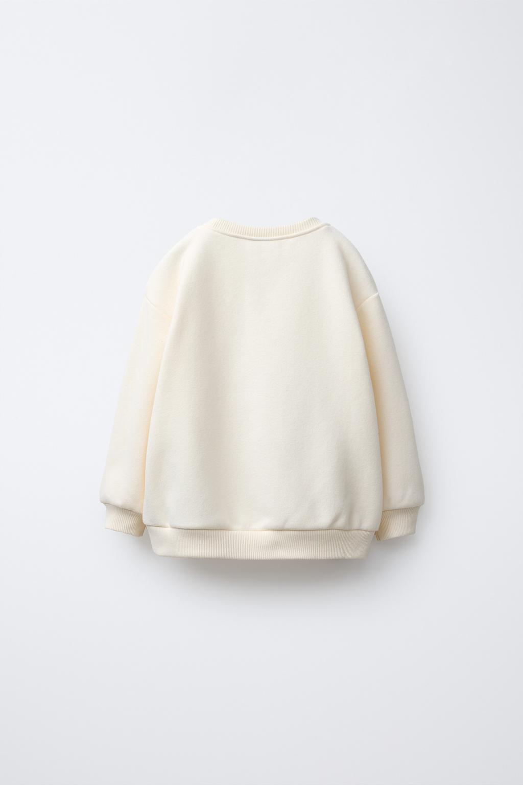 ТОЛСТОВКА С ТЮЛЕВЫМИ БАНТИКАМИ