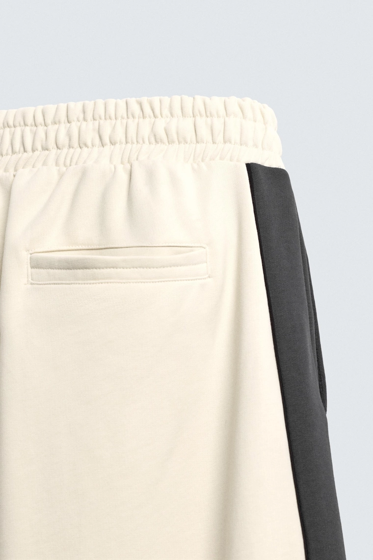 Брюки-джоггеры с широкими штанинами и боковой полосой