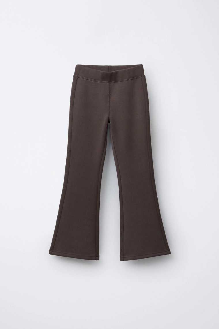 Брюки спортивного покроя с расклешенными штанинами