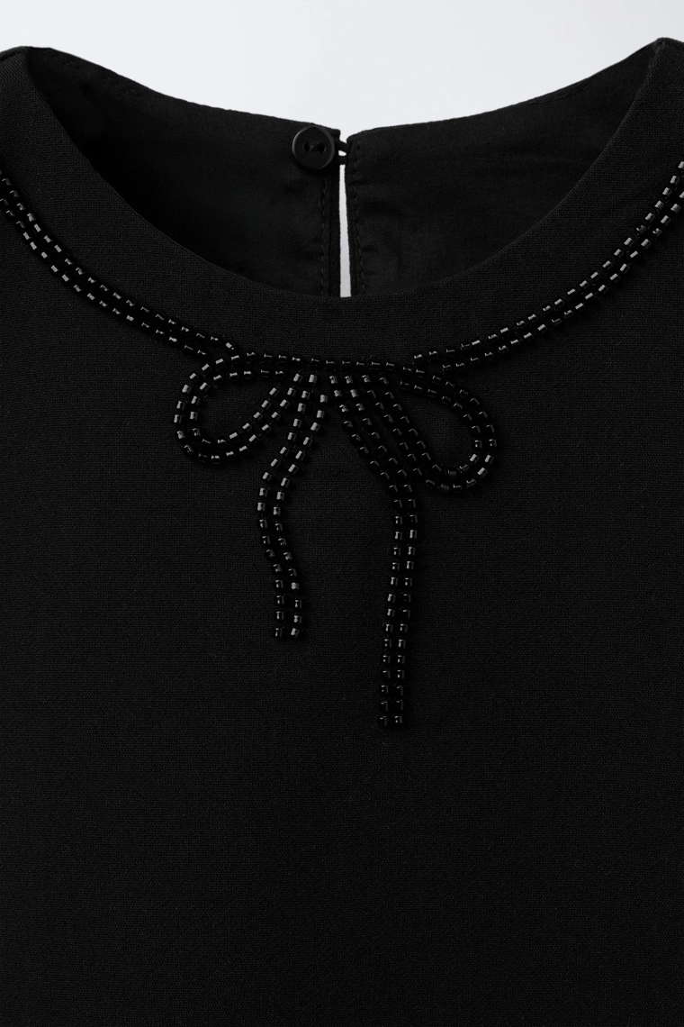 Топ с бантом и бисером