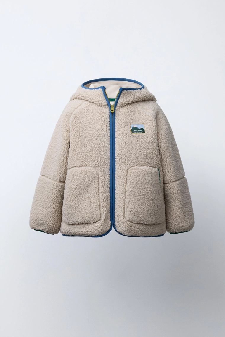 Куртка из искусственного меха с контрастными отделками