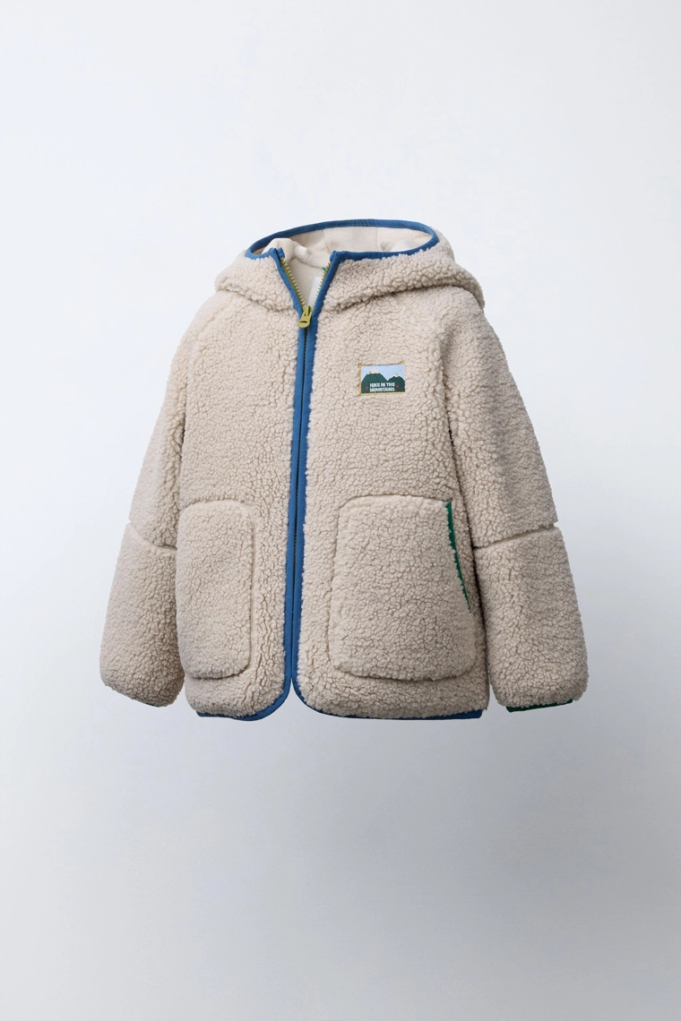 Куртка из искусственного меха с контрастными отделками