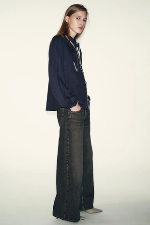 Блуза с бантом и контрастной отстрочкой- Заказать в России