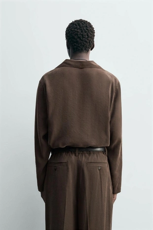 Рубашка поло с плавным фасоном- Заказать в России