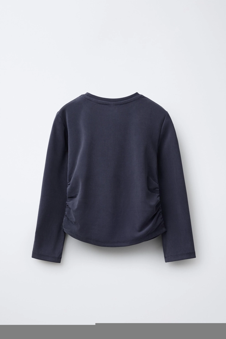 Спортивная футболка с рюшами