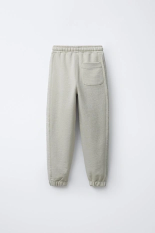 Брюки-джоггеры из комбинированной ткани- Заказать в России