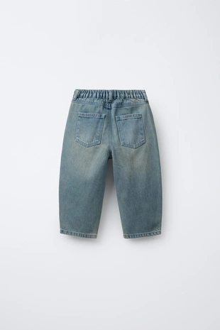 Джинсы свободного кроя с защипами- Заказать в России