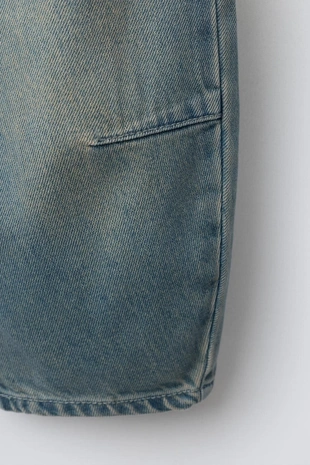 Джинсы свободного кроя с защипами- Заказать в России