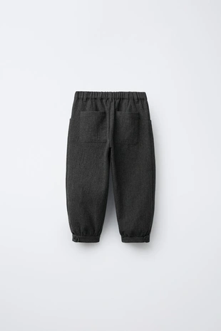 Фактурные брюки с защипами- Заказать в России