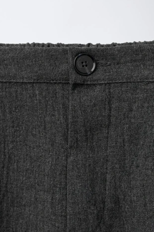 Фактурные брюки с защипами- Заказать в России