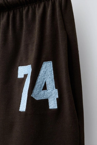 Широкие брюки из плотной мягкой ткани с вышивкой- Заказать в России