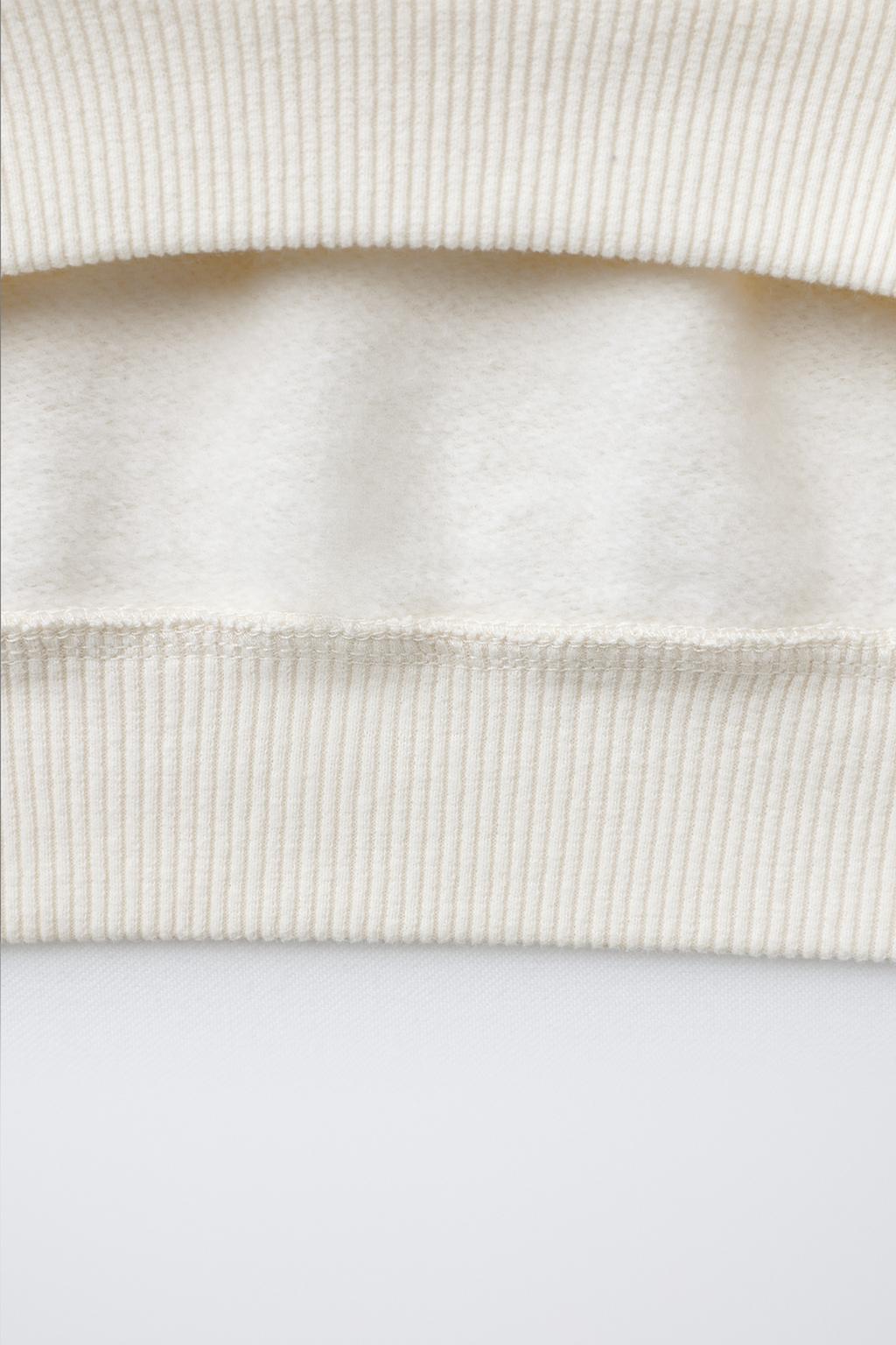 ТОЛСТОВКА С НАШИВКОЙ «ОЛЕНЬ» ИЗ ИСКУССТВЕННОЙ ОВЧИНЫ