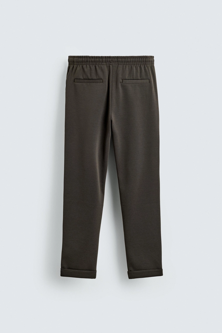 Комфортные несминаемые брюки с манжетами на талии