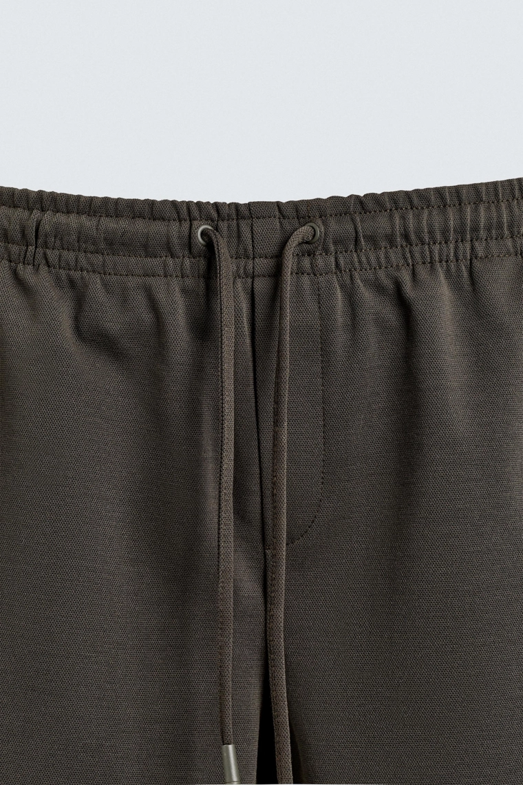 Комфортные несминаемые брюки с манжетами на талии