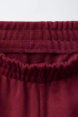 Брюки-джоггеры из мягкой ткани с текстом- Заказать в России