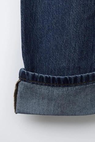 Джинсы свободного кроя с отворотами- Заказать в России