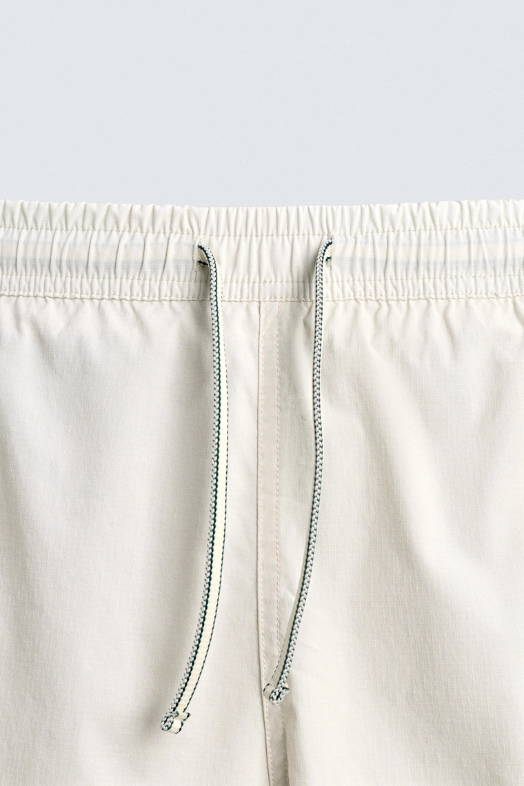 Длинные плавательные шорты в полоску