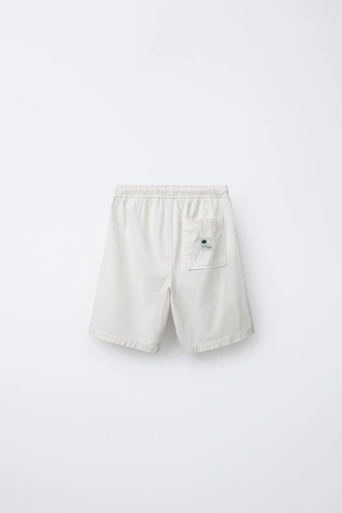 Шорты хлопковые с нашивкой- Заказать в России