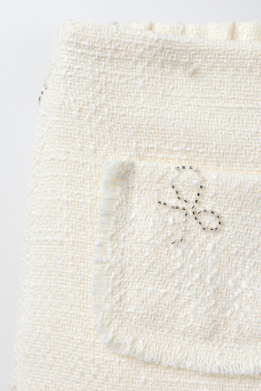 СТРУКТУРНАЯ ЮБКА С БАНТАМИ И БЛЕСКОМ