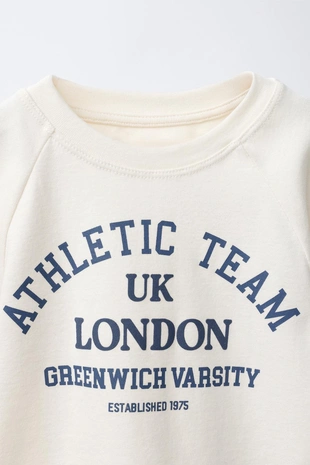 Футболка с объемными рукавами и надписью- Заказать в России