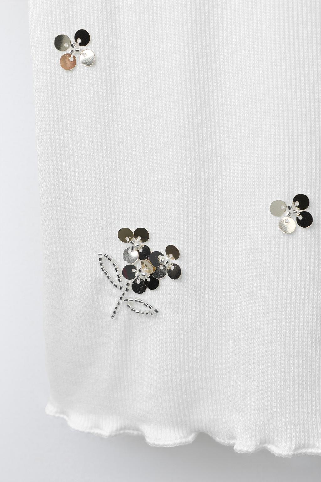 ФУТБОЛКА В РУБЧИК С ПАЙЕТКАМИ