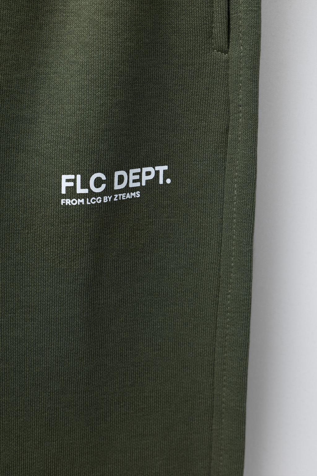 БРЮКИ-ДЖОГГЕРЫ ИЗ МЯГКОЙ ТКАНИ С НАДПИСЬЮ