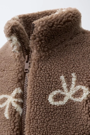 Куртка из искусственной овчины с бантами- Заказать в России