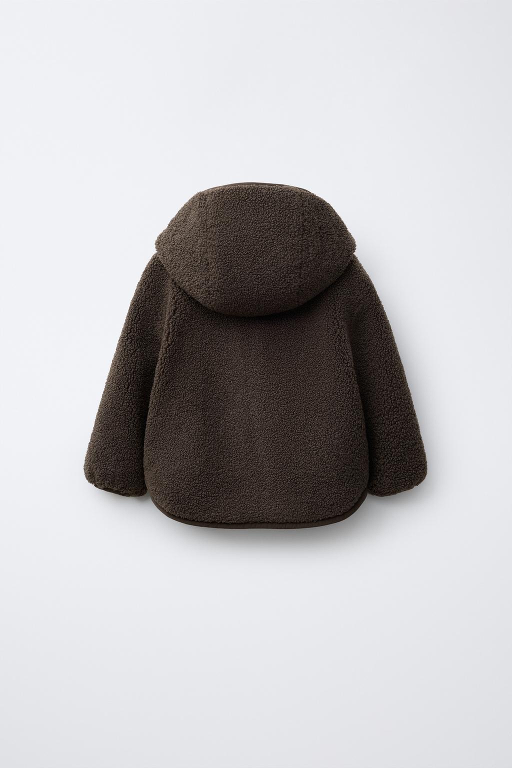 КУРТКА ИЗ ИСКУССТВЕННОЙ ОВЧИНЫ С КАПЮШОНОМ